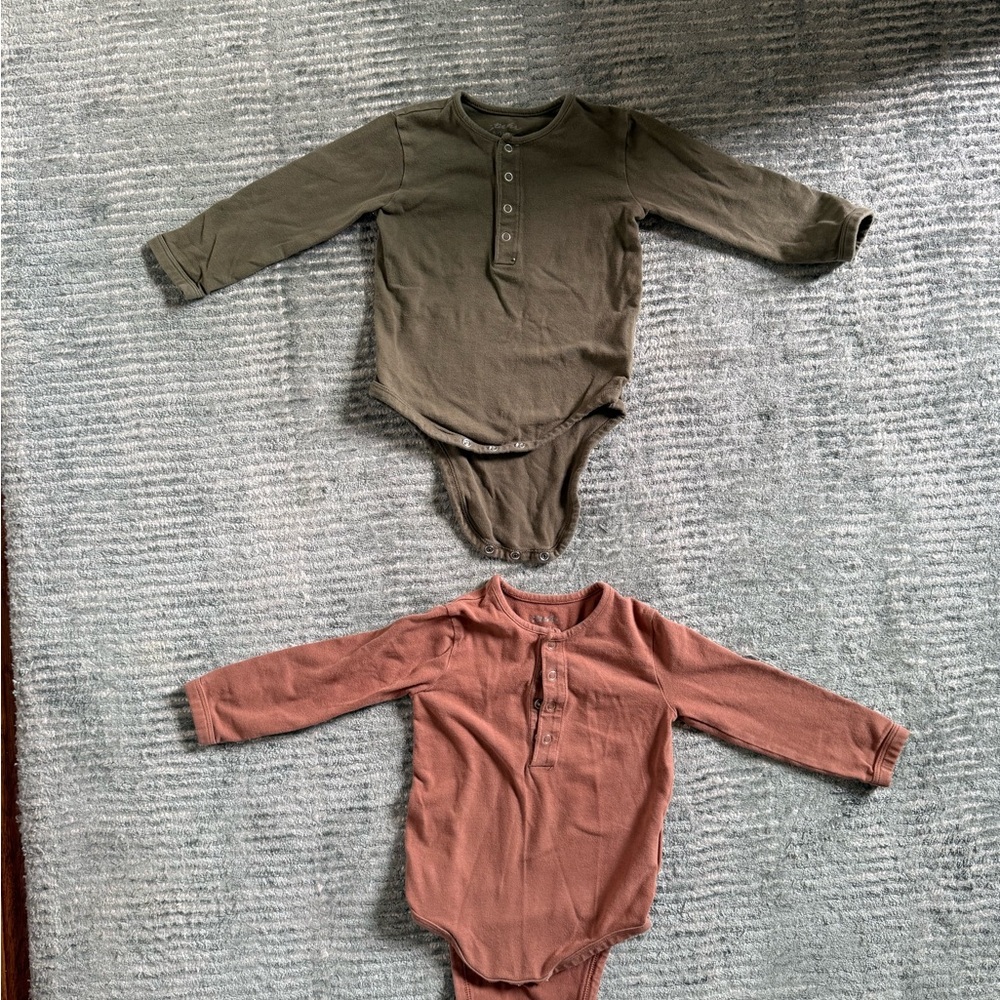 Pair of Pehr Long Sleeve Baby Onesie. Olive Green and Red Clay colors